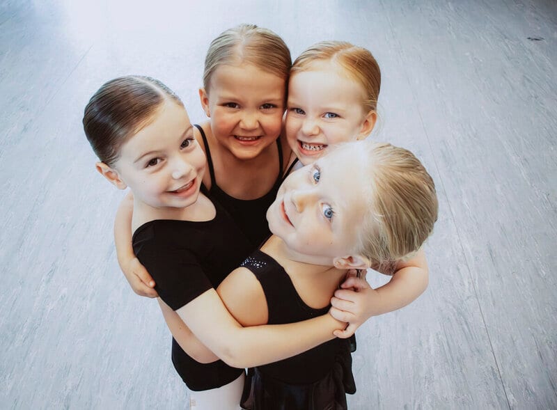 Children joining a themed summer dance camp moment