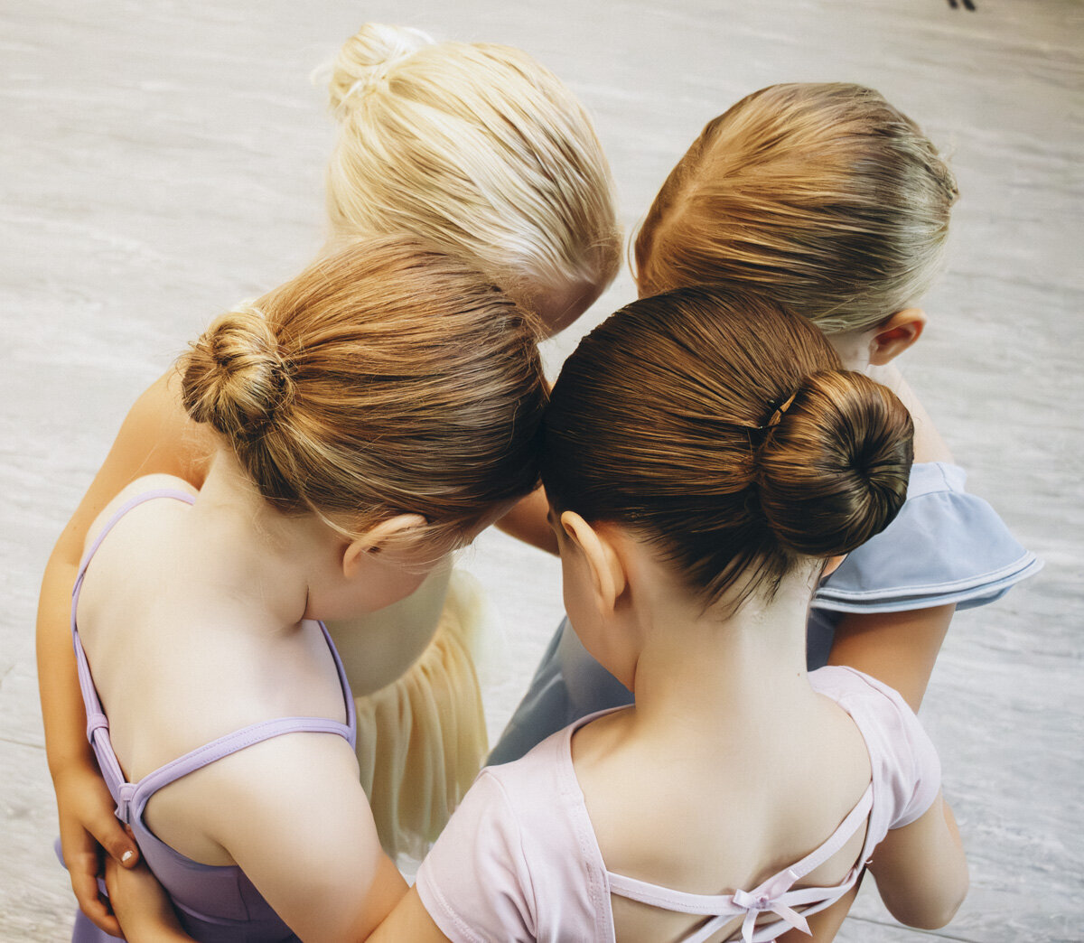 Young Snowflake Spectacular dancers sharing a cheerful camp moment at Miller Street Dance Academy